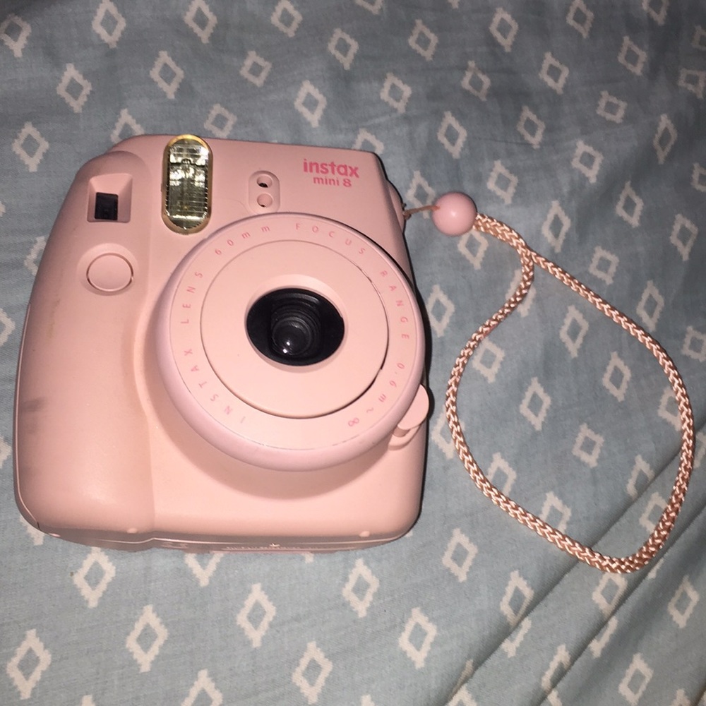 light pink polaroid camera
